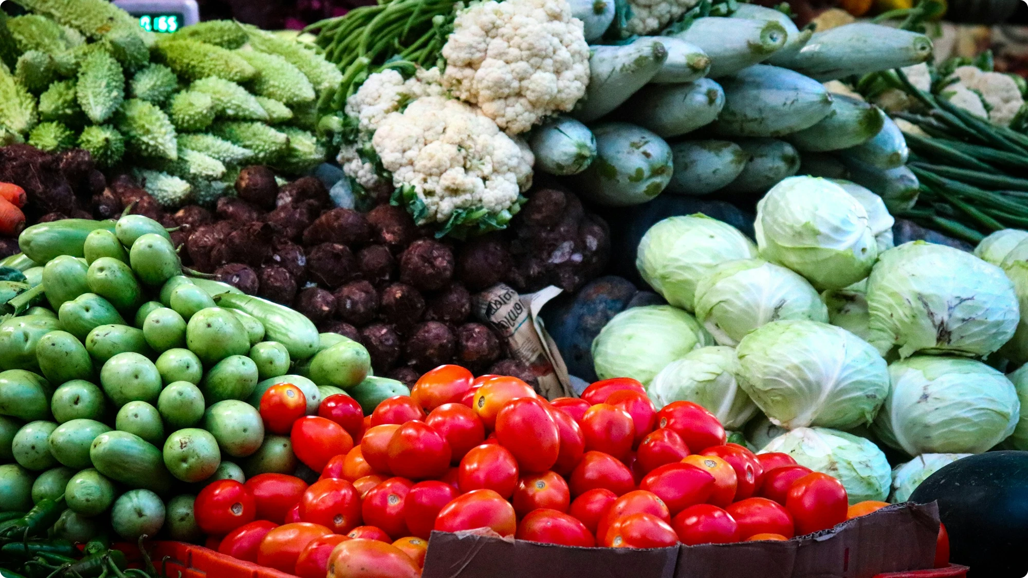 Crates of fresh vegetables at a market