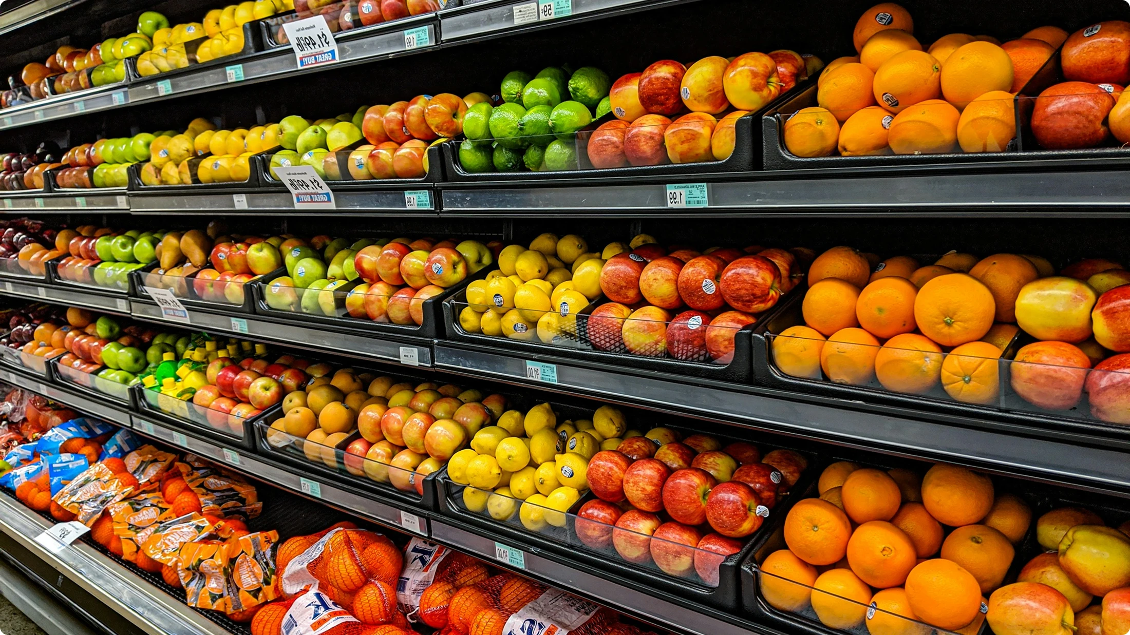 Supermarket shelf with fresh fruit and vegetables